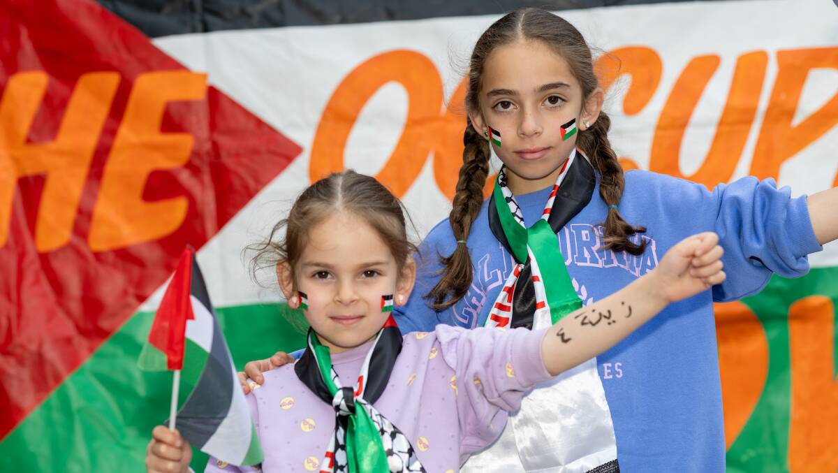 Sisters Ola and Zeina Hamze wrote their names on their arms, imitating the identification process Gazan parents undertake in case their loved ones fall victim to bombings. Picture by Gary Ramage 