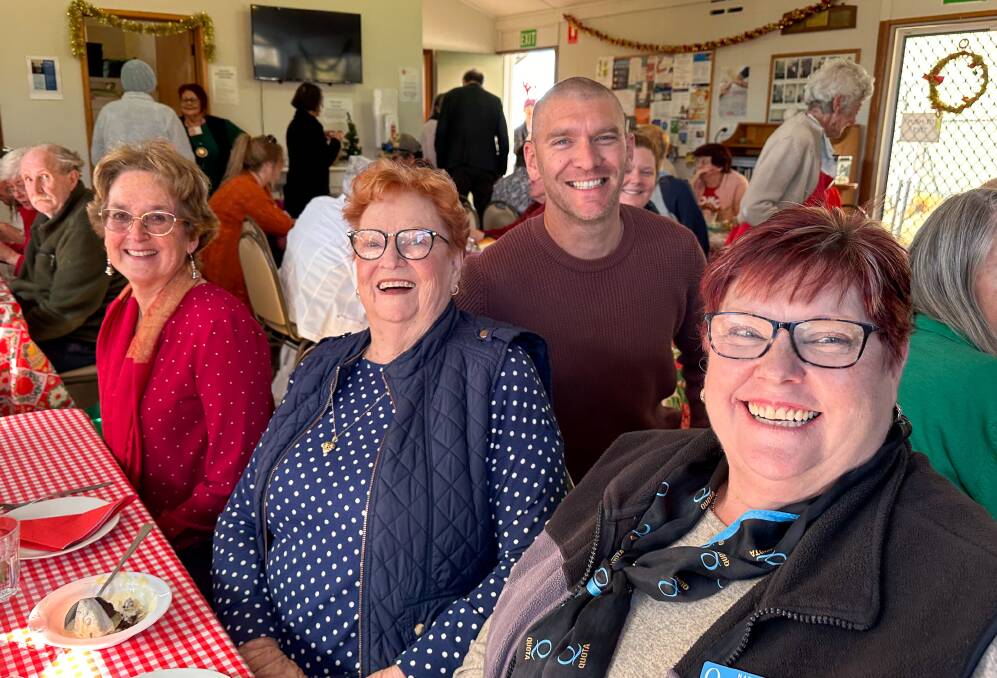 Monty's Place in Narooma has been serving free meals to the community for more than 10 years. Pictured is Mayor Mathew Hatcher at Monty's Place with Narooma locals.