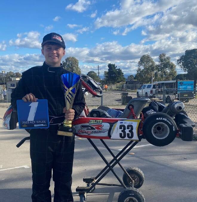 Aidan with his trusted kart and "blue plate" ACT State Title trophy after his Easter weekend win in Canberra. Picture supplied