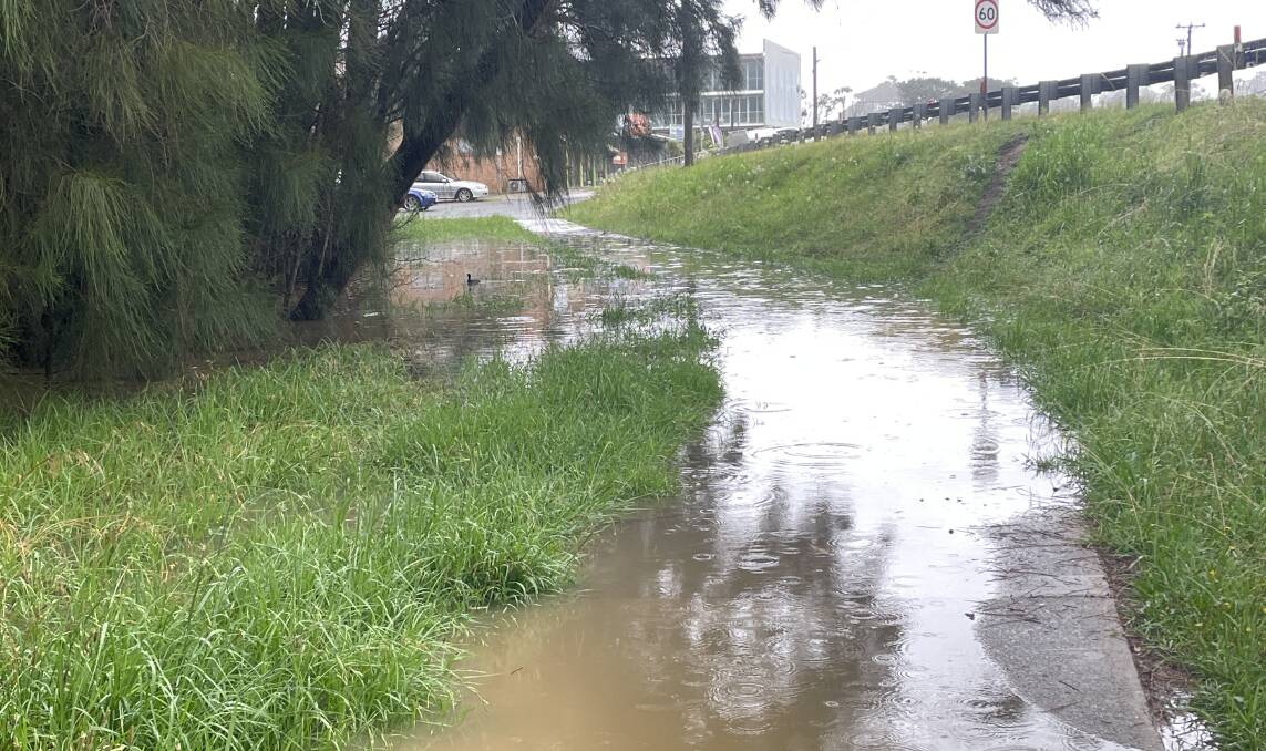 Paths were inundated near waterways in Malua Bay.