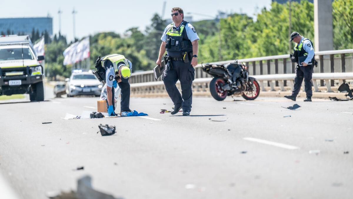 ACT Policing attend the scene of a two vehicle accident involving a motorcycle on the Commonwealth Avenue bridge. Picture by Karleen Minney