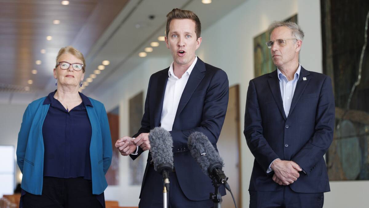 Greens housing spokesperson Max Chandler-Mather, centre, says the government knows "their housing policy is indefensible". Picture by Keegan Carroll