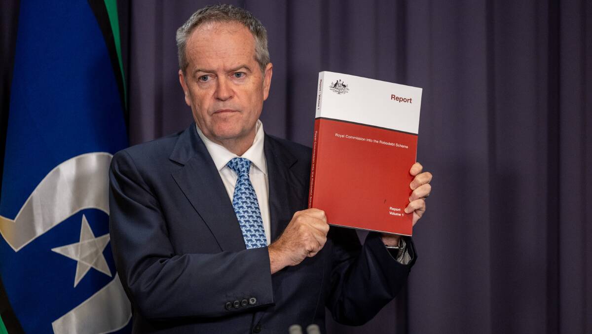 Government Service Minister Bill Shorten with the robodebt royal commission report. Picture by Gary Ramage 