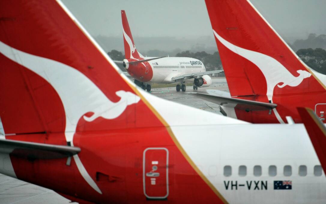 Qantas planes at an airport. Picture by Joe Armao