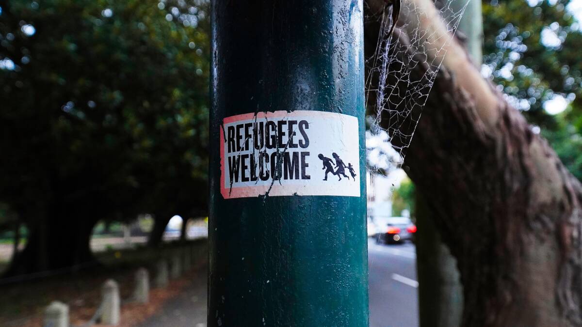 A sticker advocating for refugees in Sydney. Picture Shutterstock