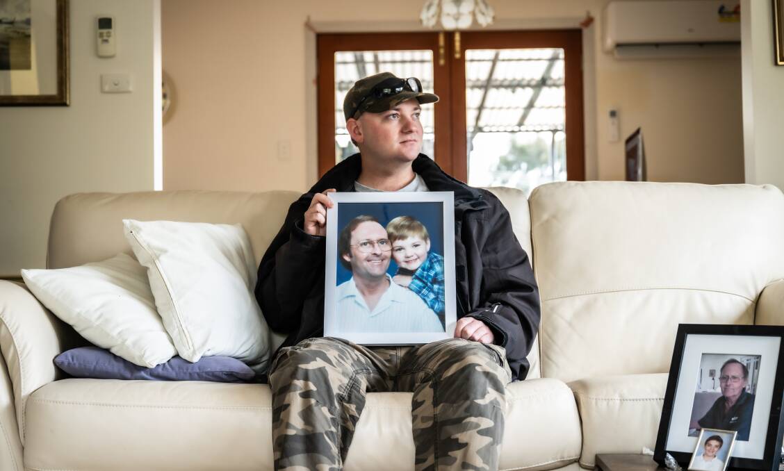 Matthew Bolton with a photo of him and his late father David. Picture by Karleen Minney