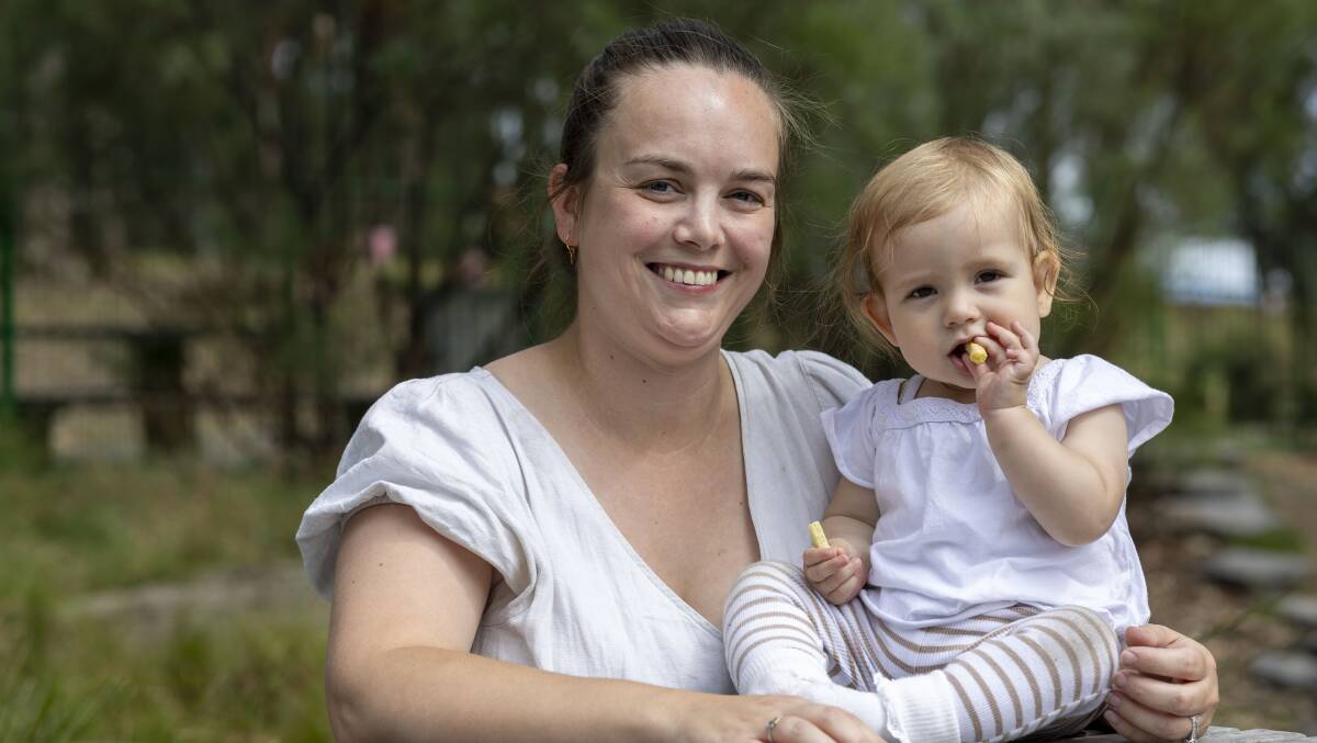 Georgia Hewison with her baby in a playground in Canberra. Picture by Gary Ramage