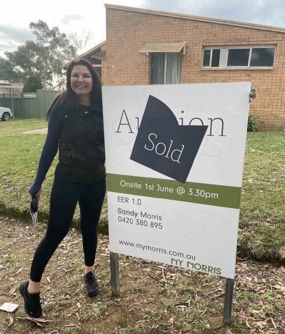 Ms Schmidt in front of her new house in Wanniassa. Picture supplied