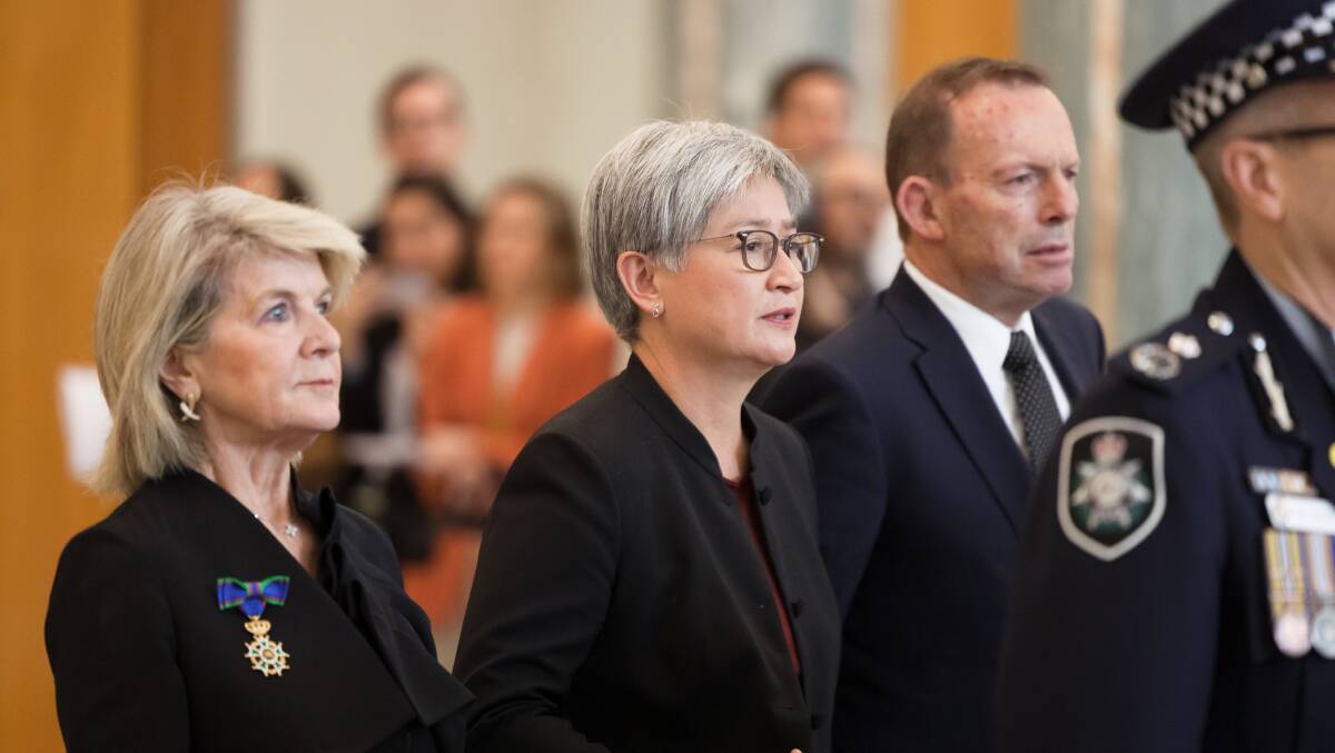 Former foreign minister Julie Bishop with Foreign Minister Penny Wong and former prime minister Tony Abbott at the MH17 memorial service in Canberra. Picture by Sitthaxay Ditthavong