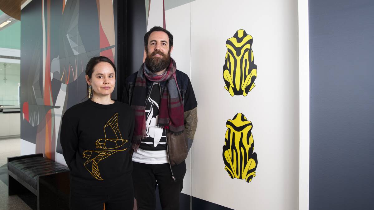 Eggpicnic artists Camila De Gregorio and Christopher Macaluso with part of their work at the airport. Picture by Keegan Carroll