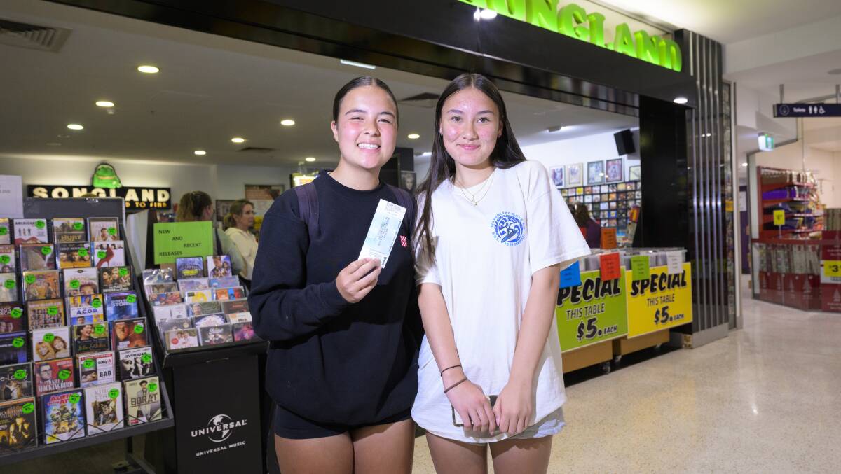 Sisters Sienna, 15, and Amelie, 14, Dy-Mortimer, of Farrer, got tickets after their dad started lining up at 3am. Picture by Keegan Carroll