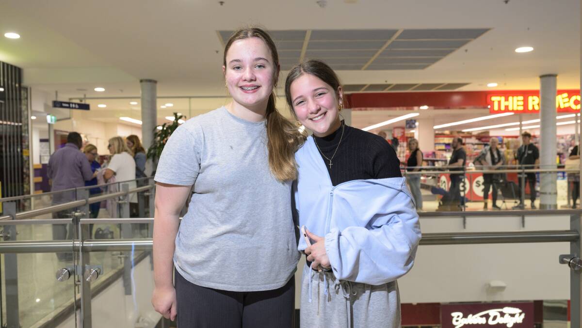 Friends Molly, 12, and Sophie, 13, both of Weston Creek, were so happy to get tickets they cried. Picture by Keegan Carroll 