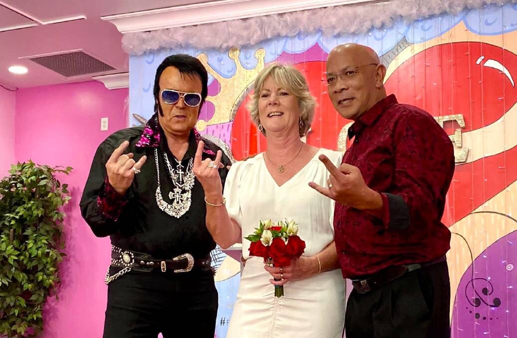 Elvis with Ann and Rohan at the colourful nuptials. Picture: Supplied