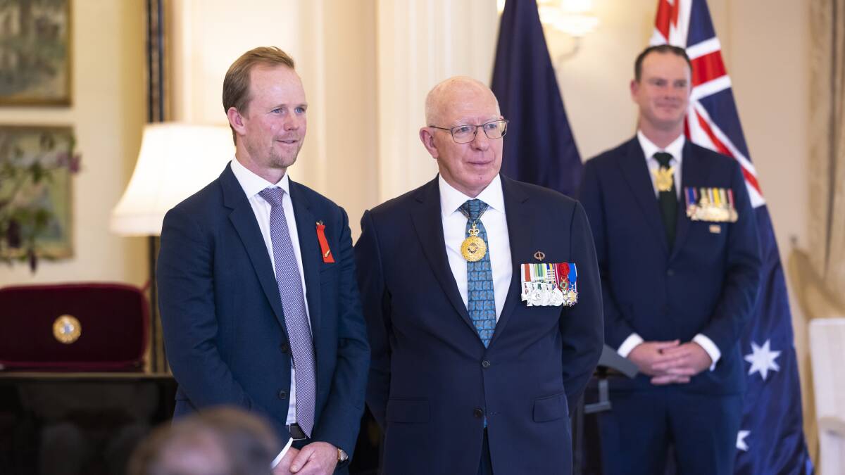 Richard Davies received his bravery award from Governor-General David Hurley at Government House on Tuesday. Picture by Keegan Carroll