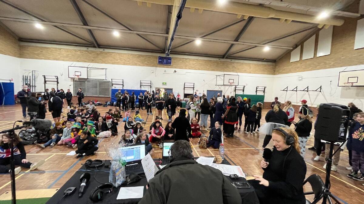 Nigel Johnson and Kristen Davidson broadcast from the basketball hall of Caroline Chisholm School on Friday morning when Ms Kennedy phoned in. Picture supplied