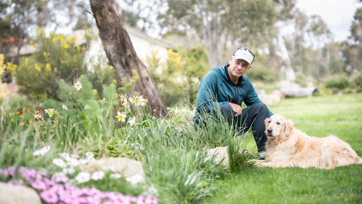 Dr Richard Agnew walks his dog Charlie through the gardens every day. Picture by Karleen Minney
