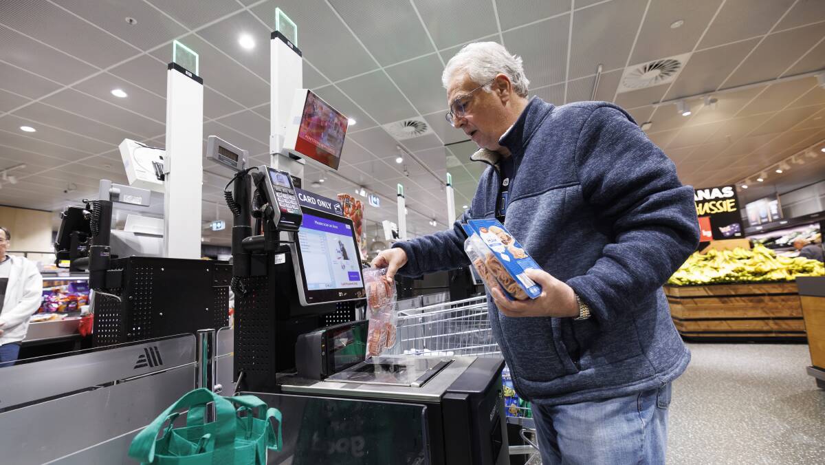  Dom Chiamarelli from Belconnen using the self-service machine at ALDI in Westfield Belconnen. Picture by Keegan Carroll