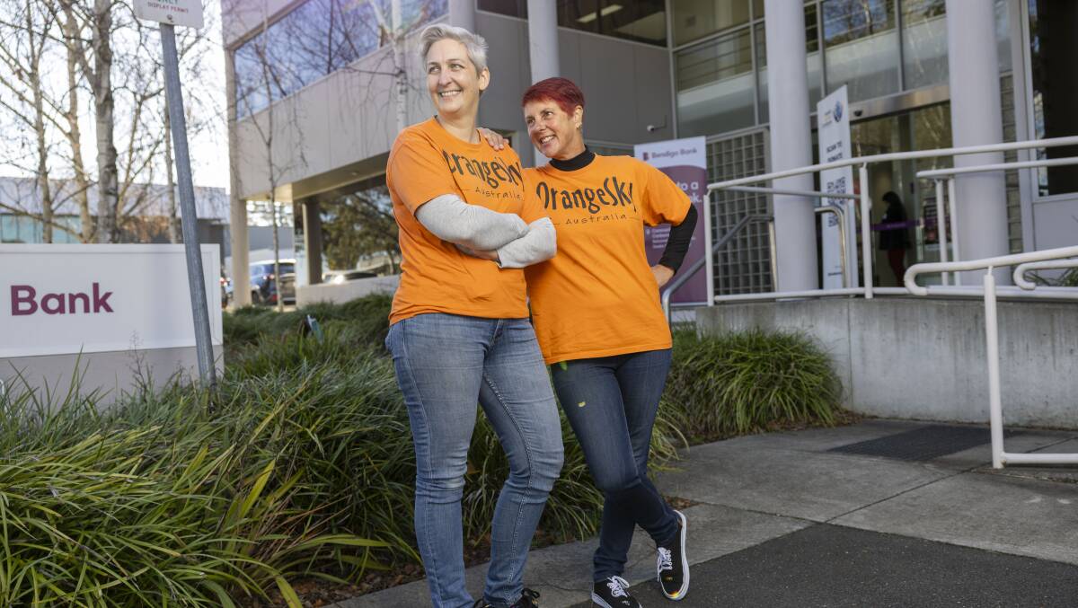 Orange Sky Australia Canberra volunteers Siobhan Leyne and Anna Dacre at the grants announcement on Wednesday. Picture by Gary Ramage