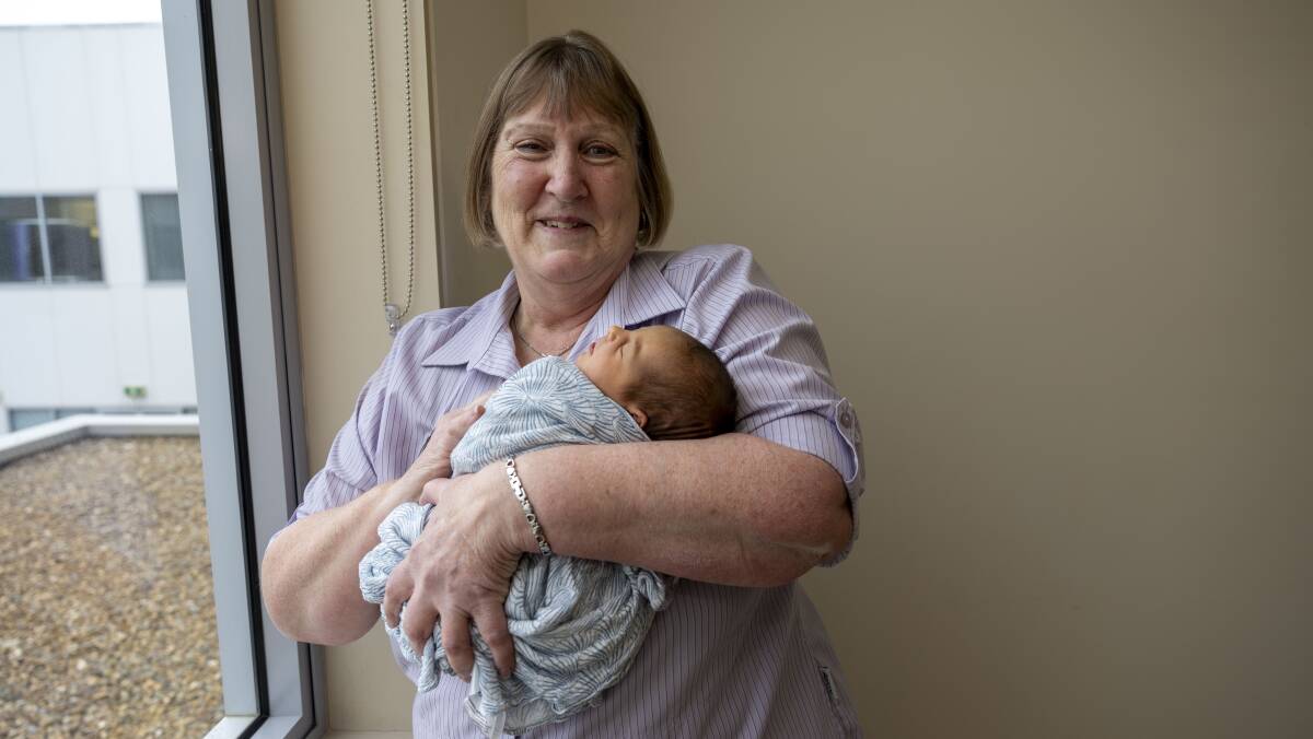 Sue Ahearn holding little Mia. Picture by Gary Ramage