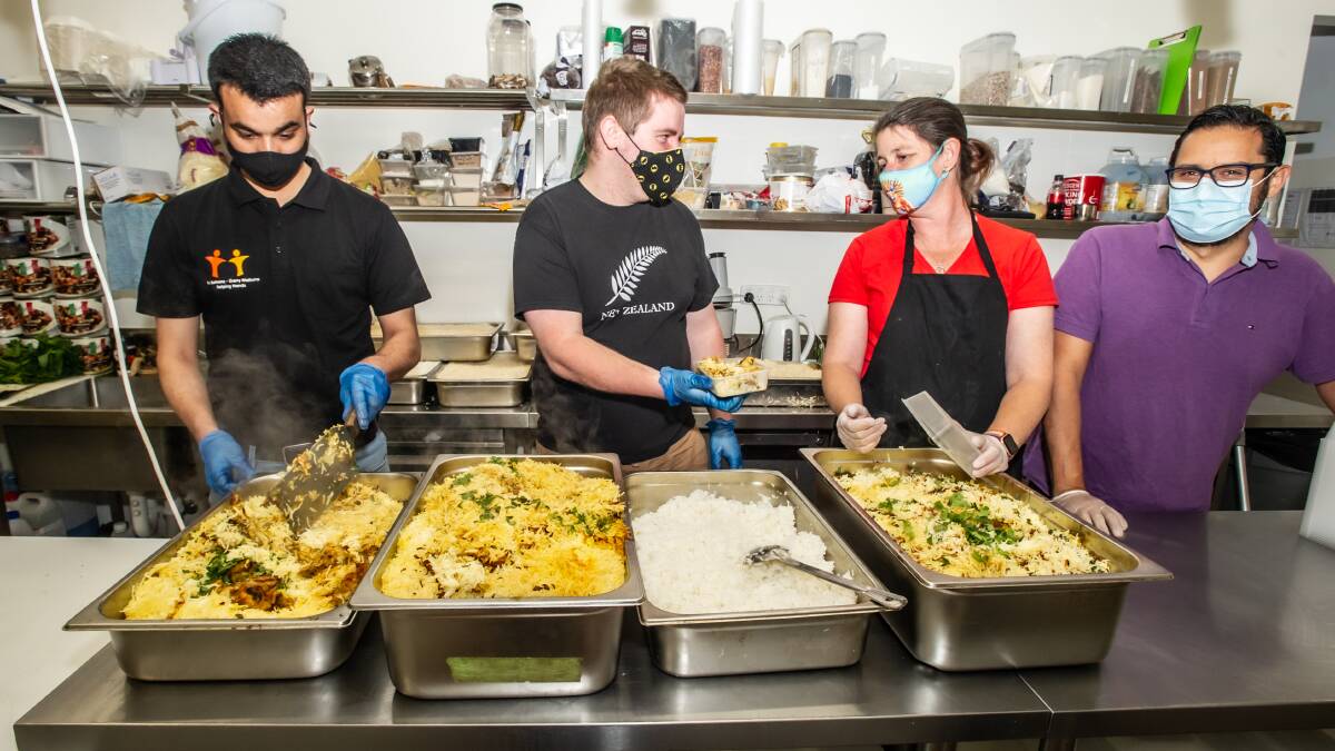Garry Malhotra, Chris Healy, Shari Maguire and Emmanuel Rodriguez helping in thje kitchen. PIctures: Karleen Minney.
