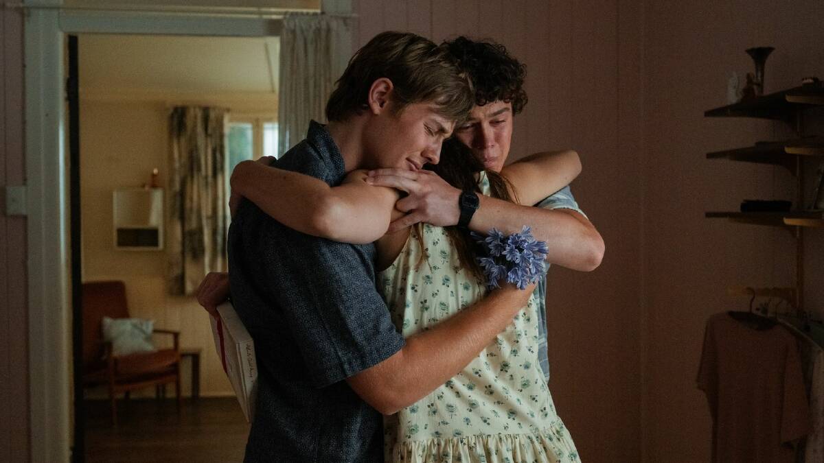The boys' mother Frankie {Phoebe Tonkin) loves group hugs. Gus is played by Lee Tiger Halley while older Eli is played by Zac Burgess. Picture by Netflix