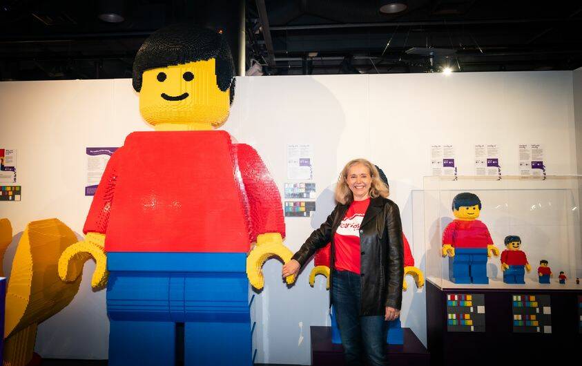Questacon director Jo White with graduating versions of Bob the LEGO man, which introduces the concept of scale. Picture by Karleen Minney