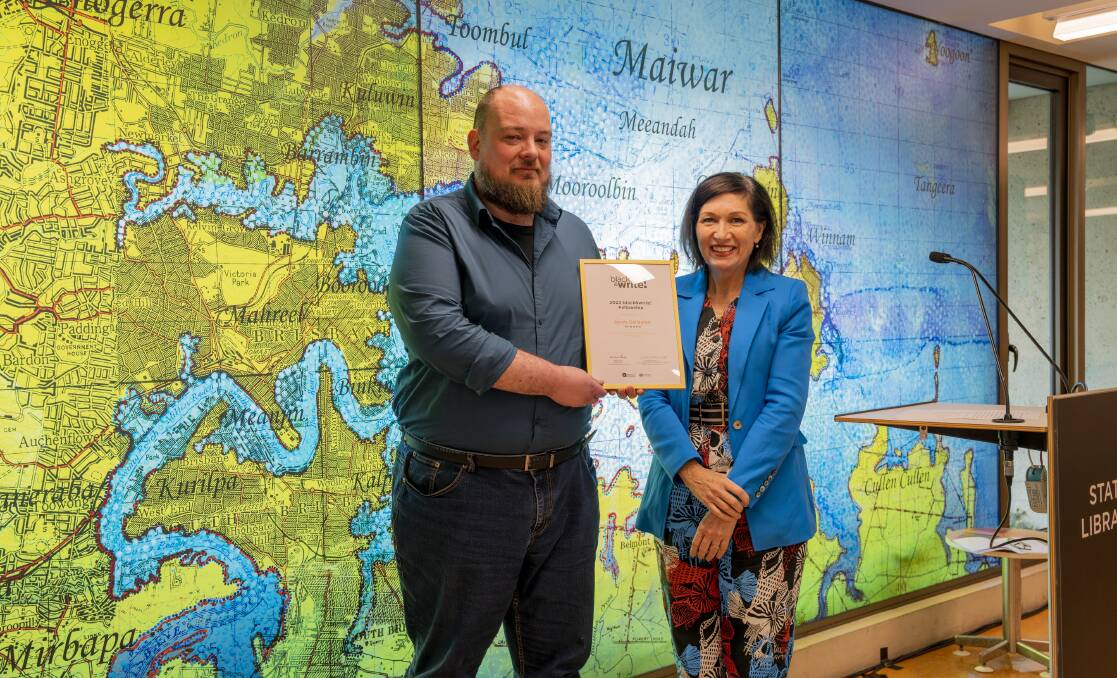 Jacob Gallagher receiving his award this week from Queensland Arts Minister Leeanne Enoch. Picture supplied