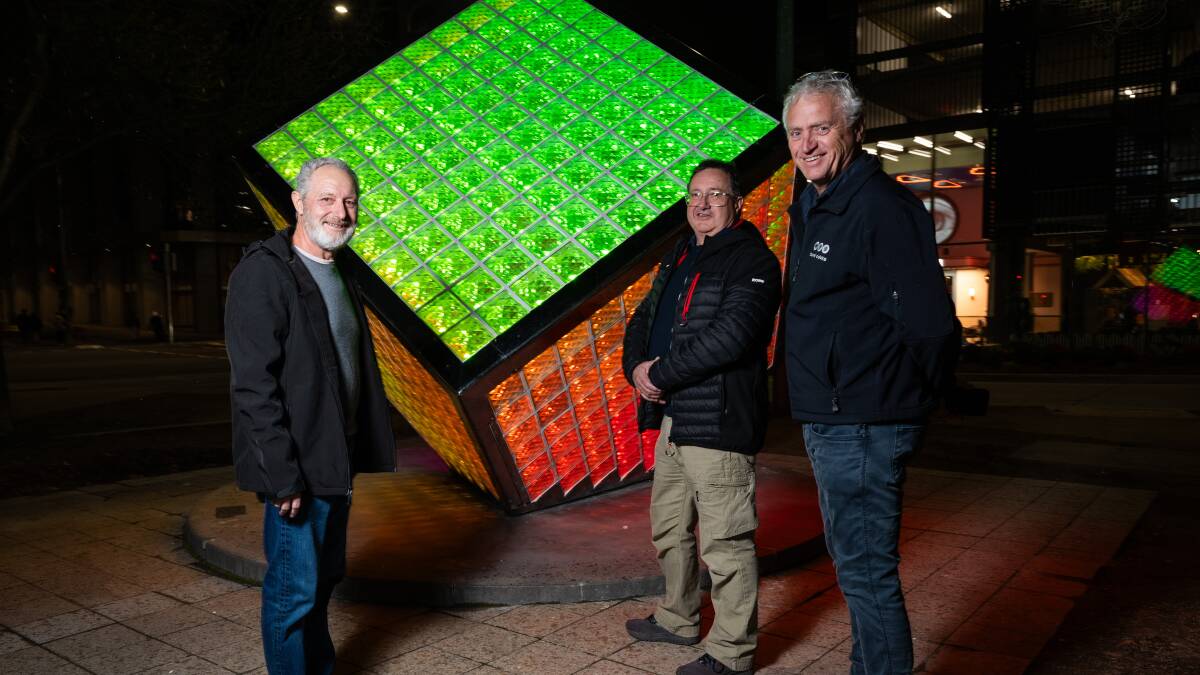  Ilumicube artist Kerry Simpson with Sound Advice lighting specialist Brett Fraser and managing director Norman Korte at the 'turning back on' of the artwork on Thursday night. Picture by Elesa Kurtz