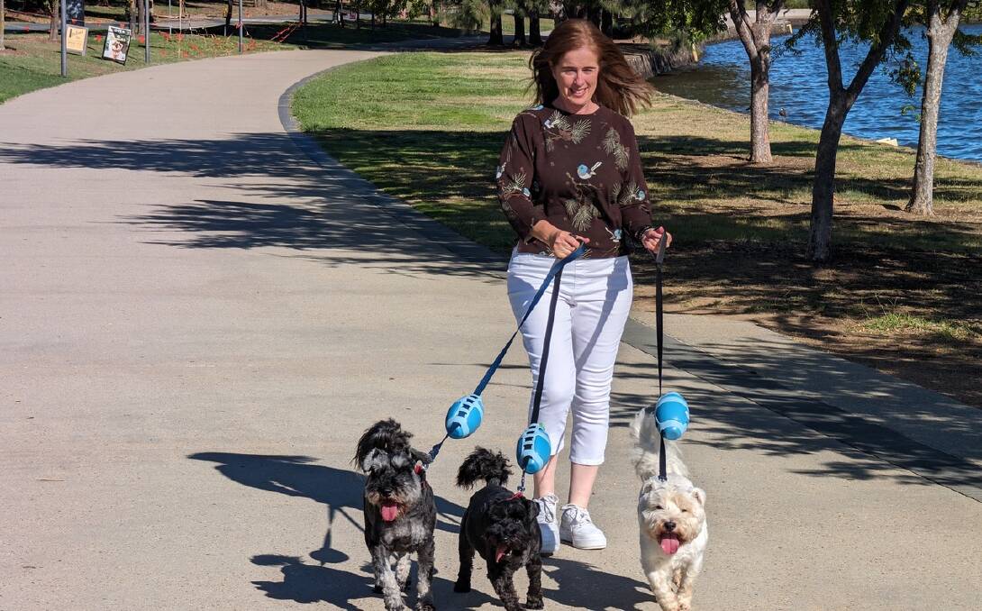 Rachel with her three dogs Milo, Baxter and Angus. The Pupoon fits on each of the leads. Picture supplied 