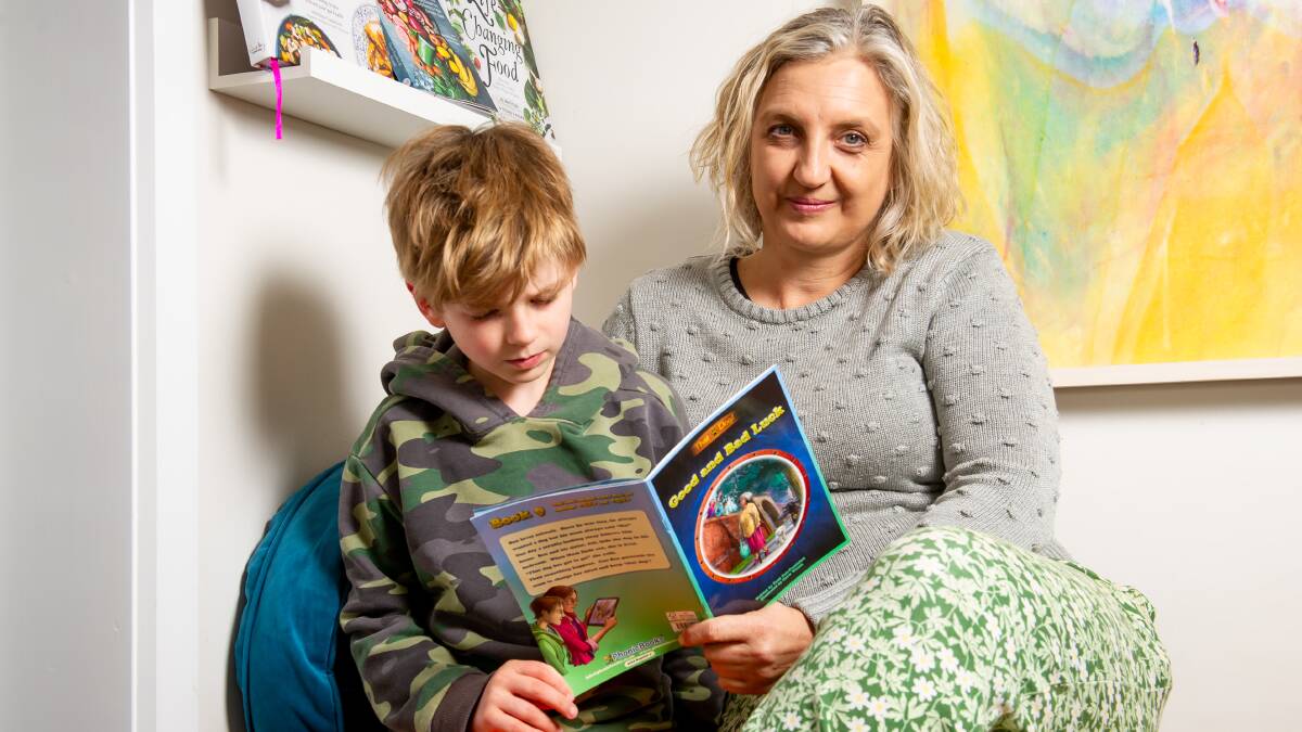 Sue White is home schooling her son, Ollie, 8, after he struggled to learn to read at school. Picture by Elesa Kurtz
