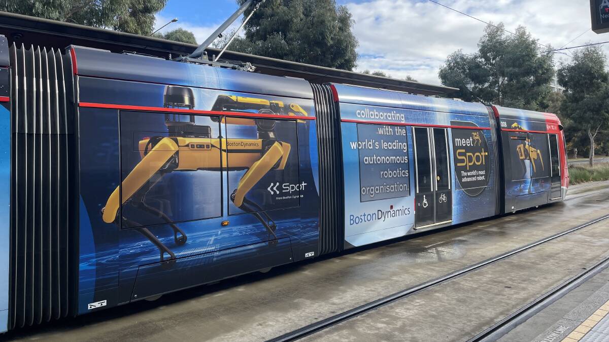 Light rail vehicle displaying an advertisement for the Spot robot from Boston Dynamics. Picture by Scott Hannaford