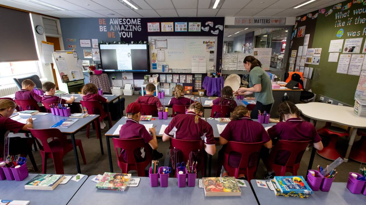 A class does a spelling lesson at St Monica's Primary School in Evatt. Picture by Elesa Kurtz