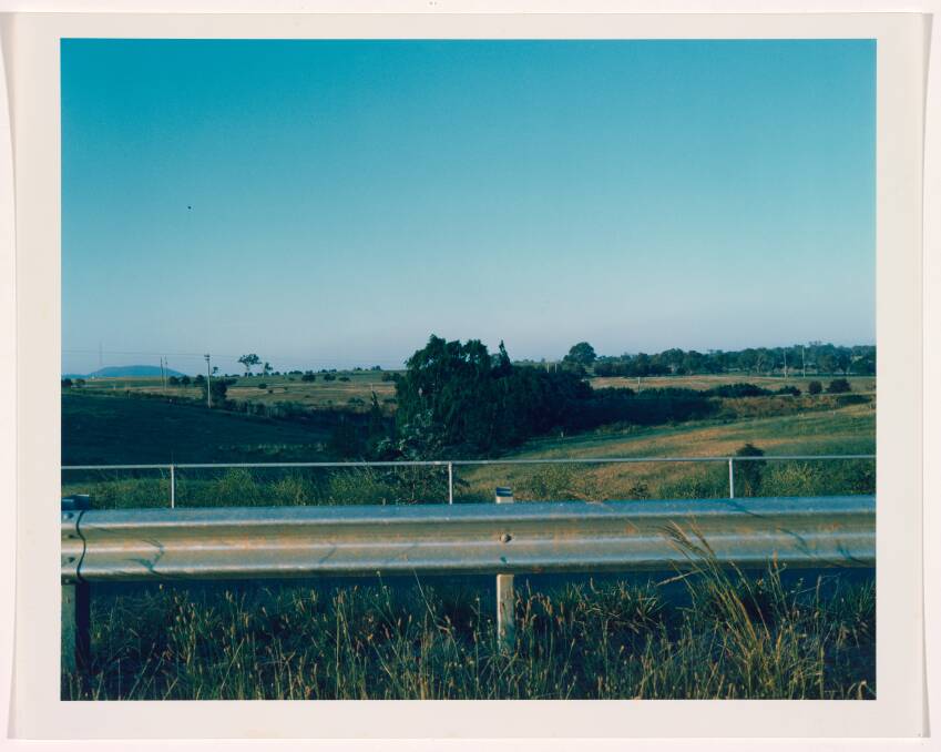 Canberra suite #12 (Guard rail and open land), 1980, Type C colour photograph, 37 h cm, 45.7 w cm, National Gallery of Australia, Kamberri/Canberra, gift of the artist 1987.