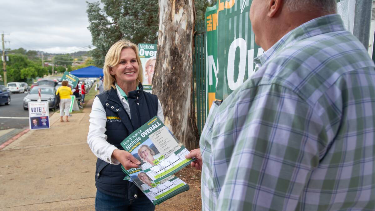 The incumbent member for Monaro, the Nationals' Nichole Overall, handing out how-to-vote cards in Queanbeyan on Saturday. Picture by Elesa Kurtz