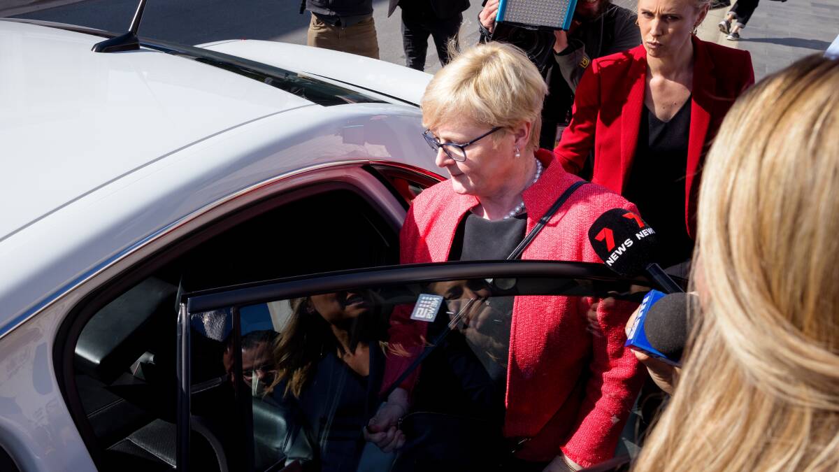 Linda Reynolds, centre, leaves the ACT courts on October 17, 2022 after giving evidence in the trial of Bruce Lehrmann. Picture by Sitthixay Ditthavong