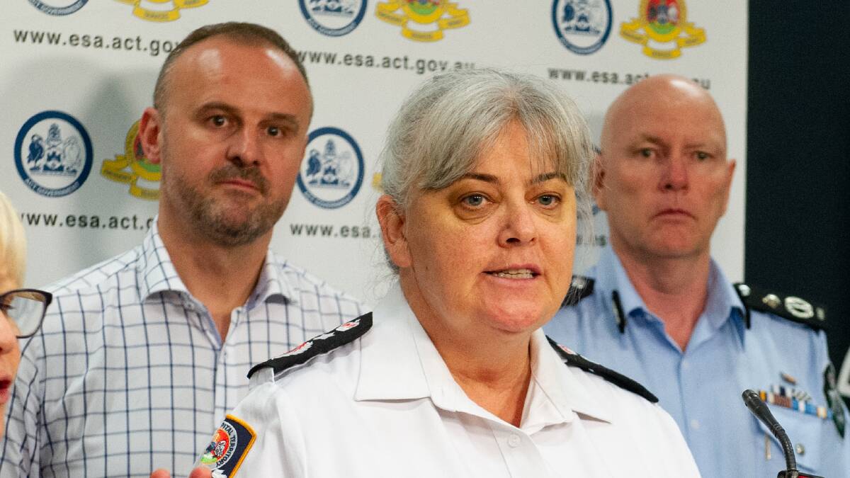 Ms Whelan addresses a press conference on January 5, 2020 during a state of alert for the ACT alongside Chief Minister Andrew Barr, right, and then ACT chief police officer Ray Johnson. Picture by Elesa Kurtz