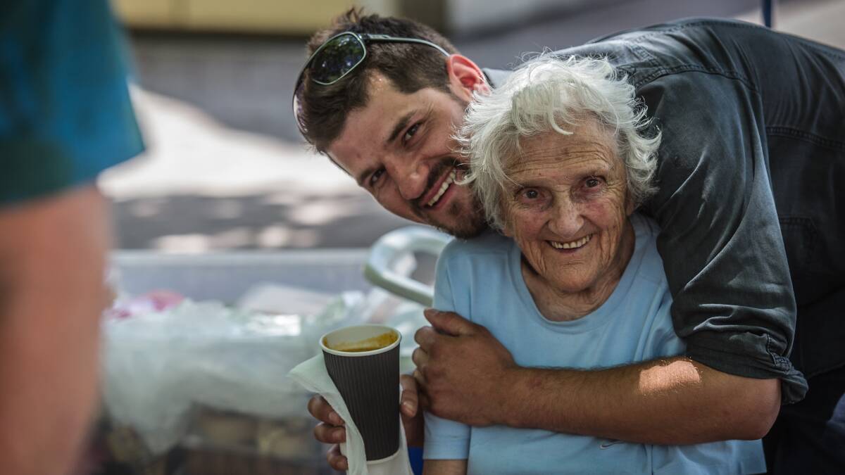 Josh Kenworthy embraces Dabrowski, his grandmother, in Garema Place in December 2016. Picture by Karleen Minney