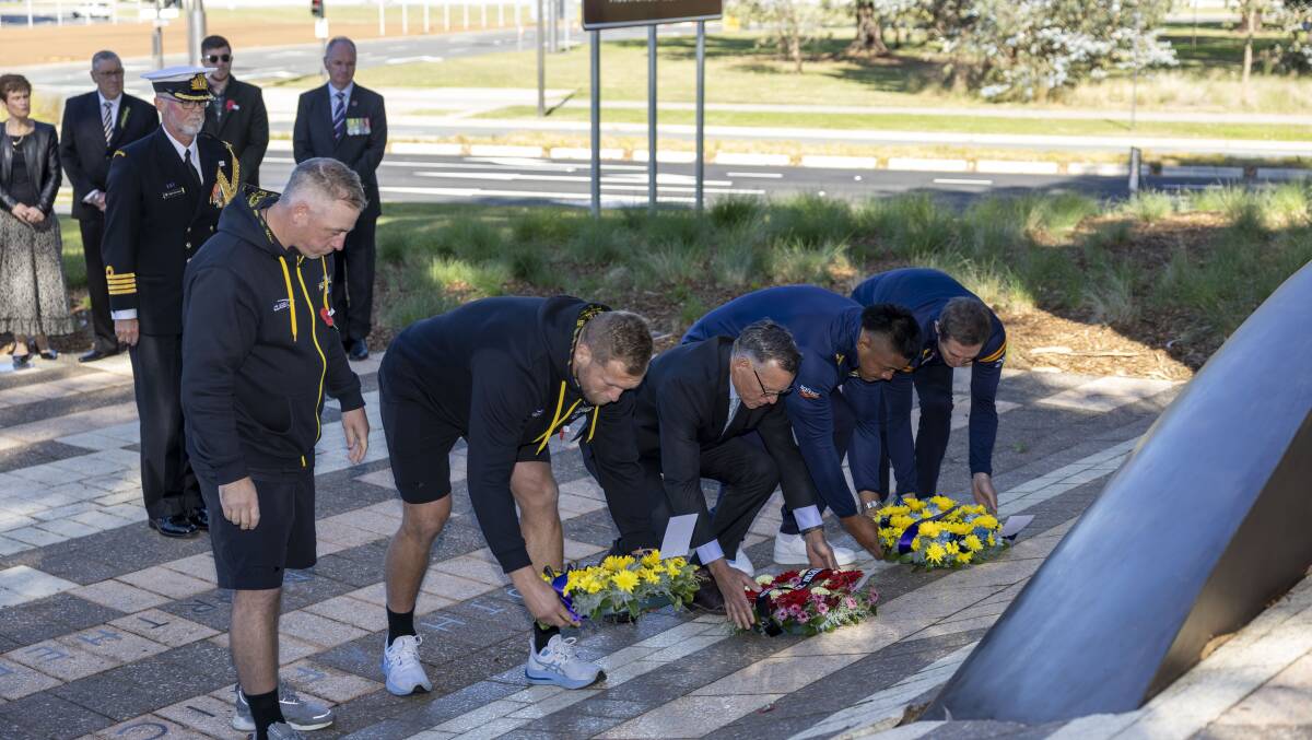 The Hurricanes and Brumbies both participated in a memorial service on Friday. Picture by Gary Ramage