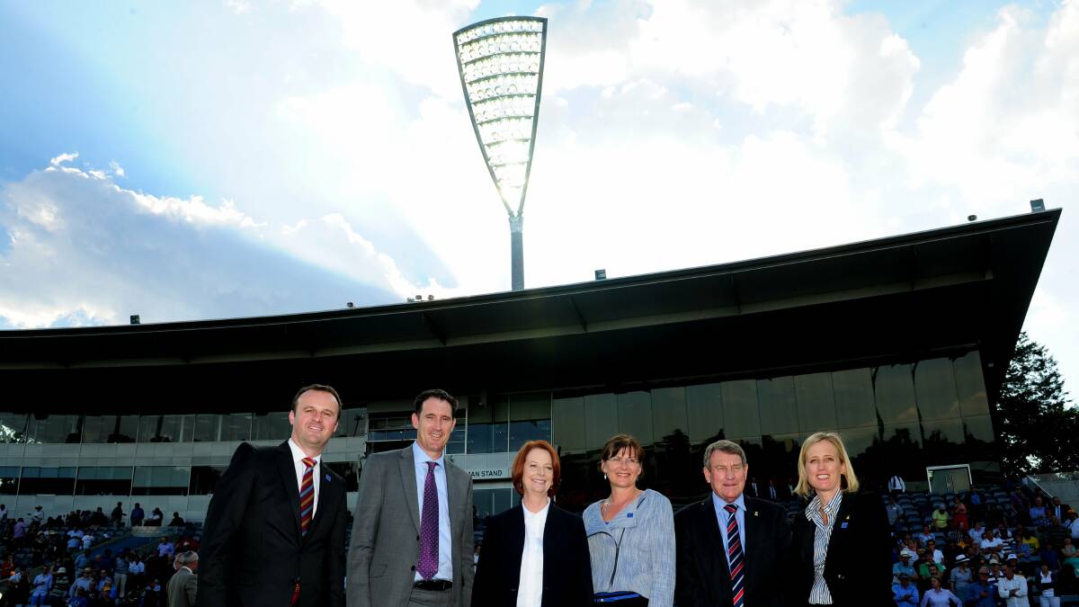 Andrew Barr, James Sutherland, then-Prime Minister Julia Gillard, Kate Lundy, Ian McNamee and Katy Gallagher under Manuka Oval's new lights in 2013. Picture by Melissa Adams
