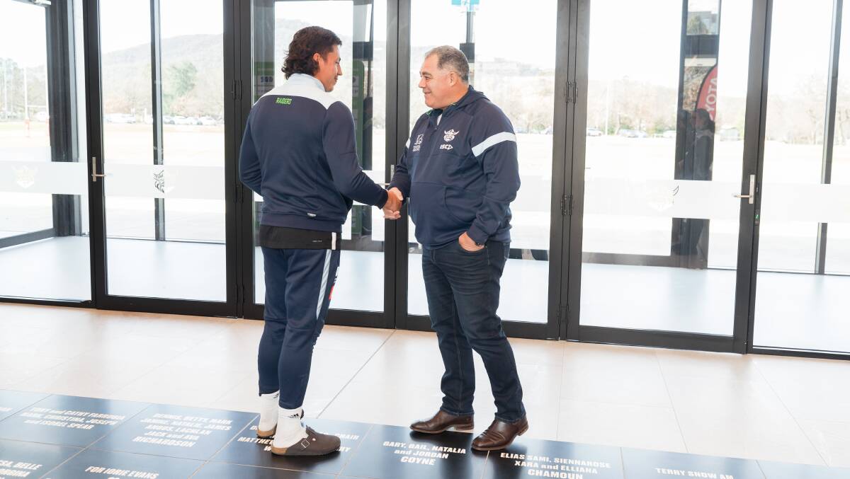 Mal Meninga is greeted by Joe Tapine at Raiders HQ. Picture by Sitthixay Ditthavong