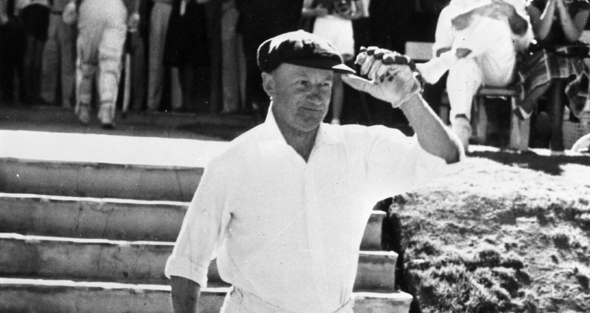 Don Bradman heads to the crease for the Prime Minister's XI in 1963. Picture Getty Images