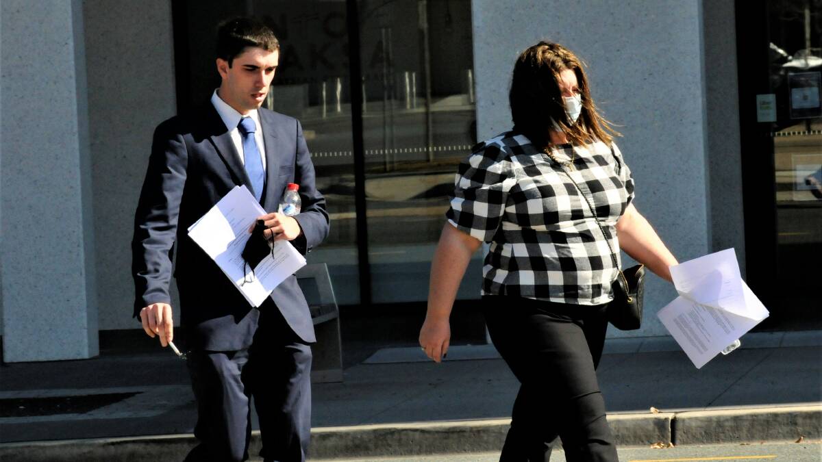 Darcy Page, left, walks through Civic with his mother after a sentence hearing in 2021. Picture by Blake Foden