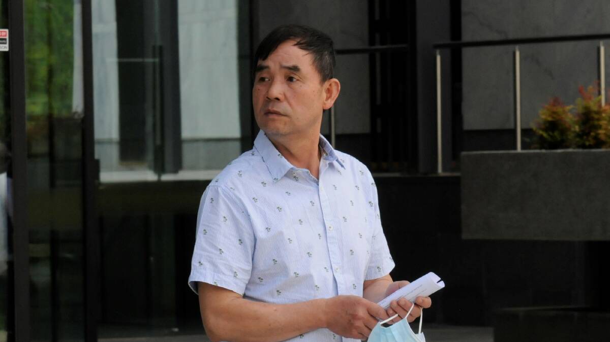 Fu Lo leaves court after being granted bail on Tuesday. Picture by Blake Foden