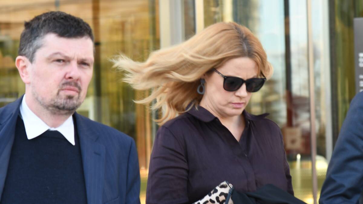Emma Morton, right, leaves court with solicitor Michael Kukulies-Smith on Friday. Picture by Blake Foden