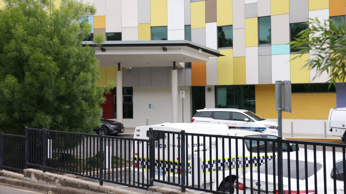 A police vehicle outside Canberra Hospital's adult mental health unit after the alleged murder. Picture by James Croucher