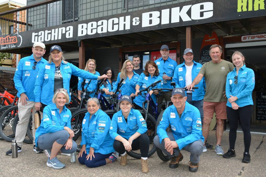 The Adventure All Stars cast members are joined by Frankie J Holden at Tathra Beach and Bike on Tuesday ready for an e-biking tour. Picture by Ben Smyth