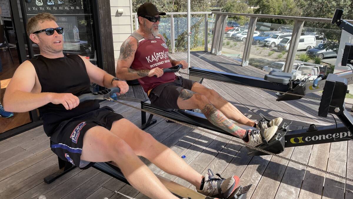 Liam O'Neill and David Barros take Pambula SLSC towards the 24-hour row finish line late on Sunday morning. Picture by Ben Smyth