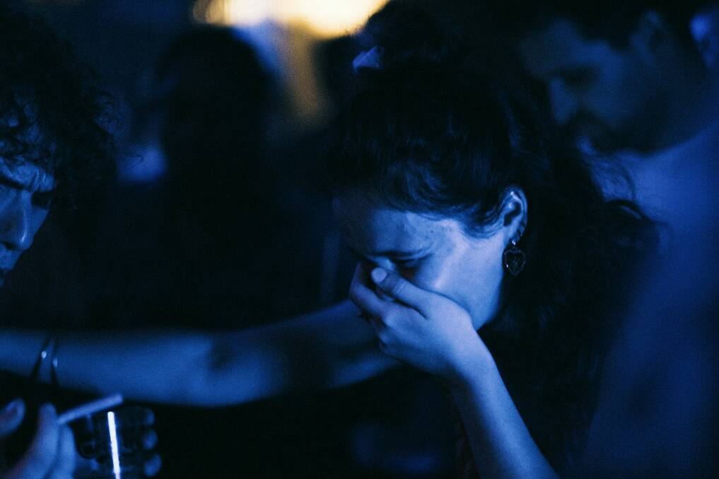 A woman crying. Picture by Peter Bucks, Unsplash