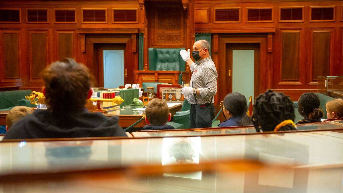 Learning facilitator Neil Roach takes a school tour in the House of Representatives at the Museum of Australian Democracy at Old Parliament House. Picture by Elesa Kurtz