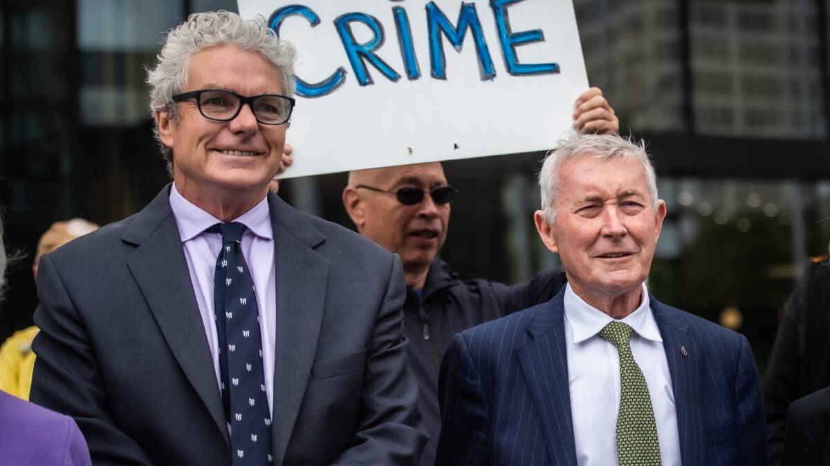 A 2022 rally in support of army whistleblower David McBride, left, outside the ACT courts, with lawyer Bernard Collaery. Picture by Karleen Minney